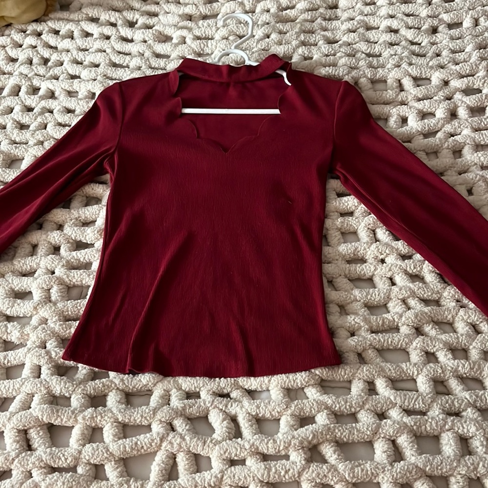 Scallop cut out cranberry colored top